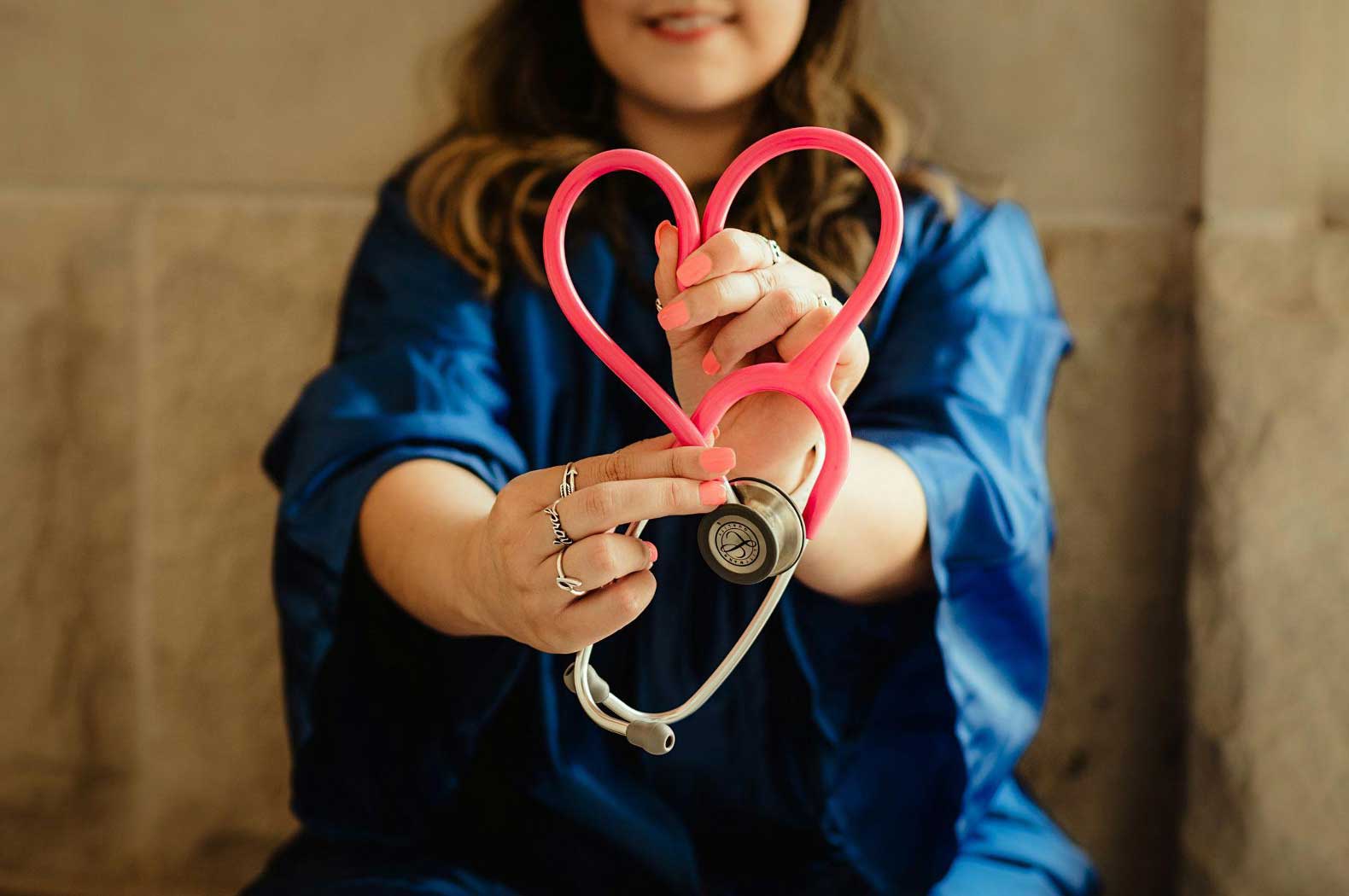 Polk HealthCare Plan nurse holding stethoscope in a heart shape