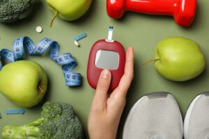 Blood sugar monitoring tools, healthy foods, and fitness items representing diabetes awareness and prevention.
